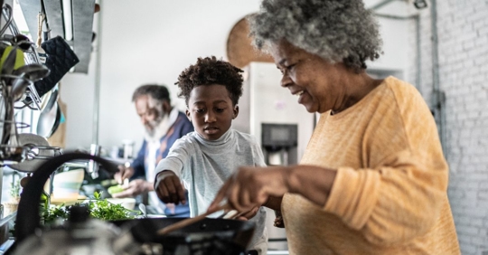 Grandma and grandson cooking together