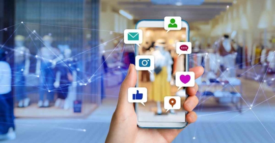 Various social media icons over a phone